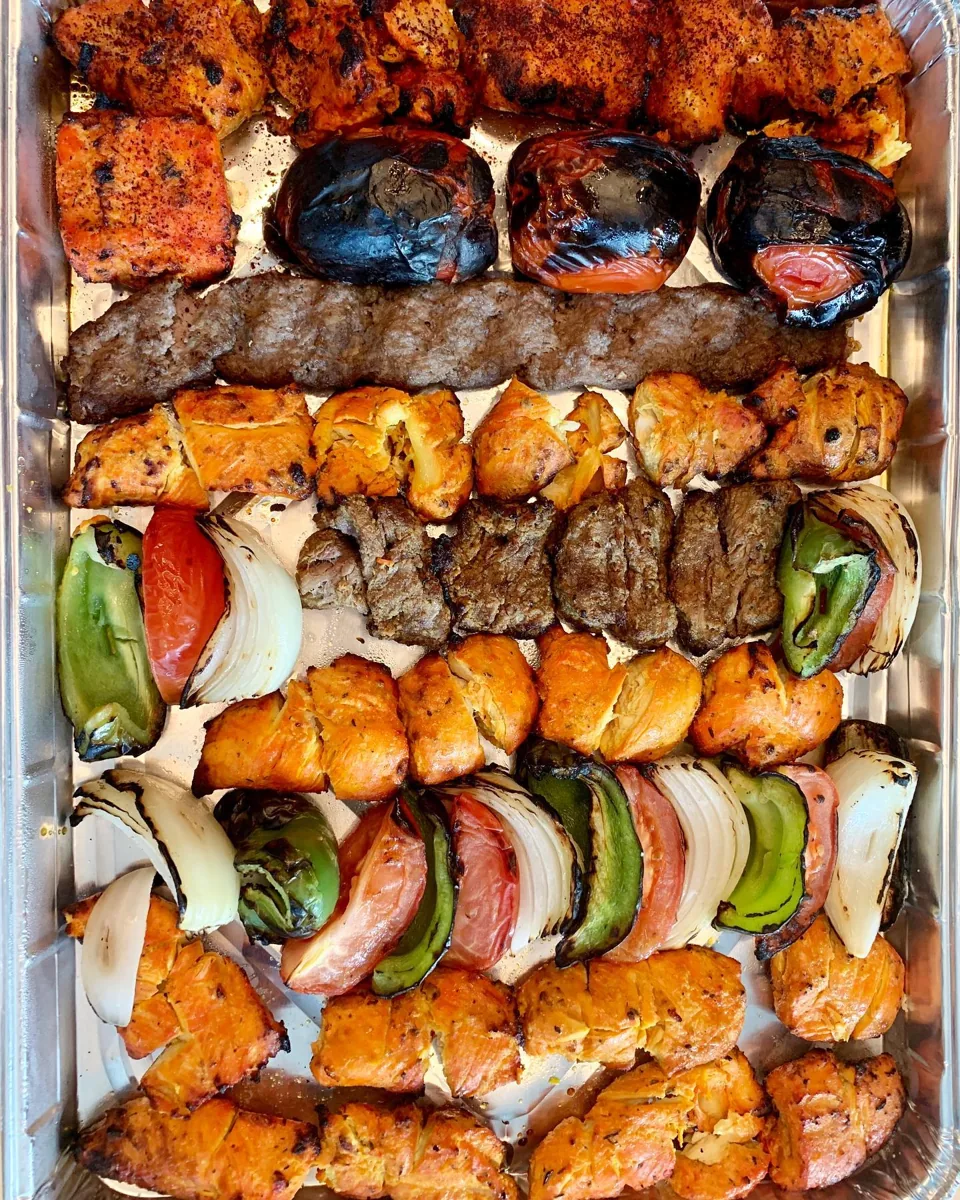 A catering tray of mixed kabobs